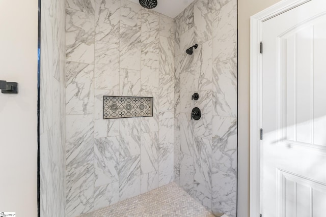 full bath with a tile shower