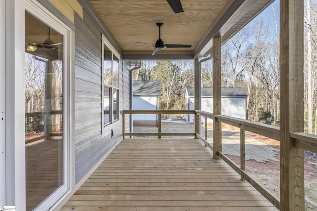 wooden deck with a ceiling fan