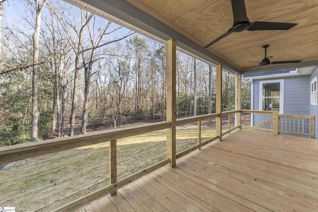 wooden terrace with a ceiling fan