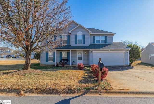 view of front of home with covered porch, a garage, and a front lawn