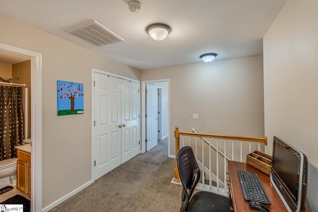 hallway with light carpet