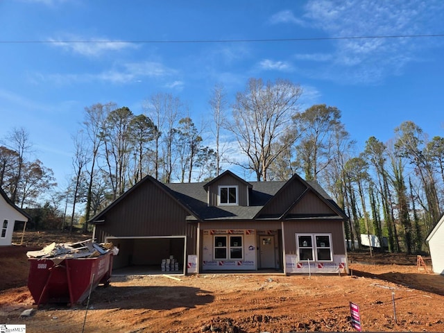 view of front of house with a porch and a garage