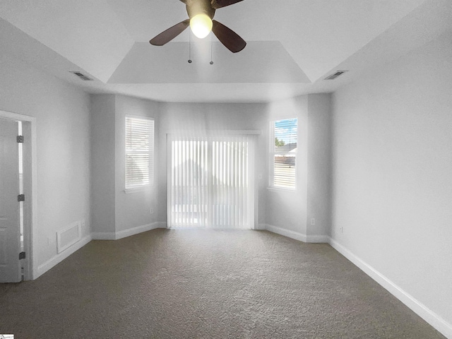 spare room with carpet flooring, ceiling fan, and vaulted ceiling