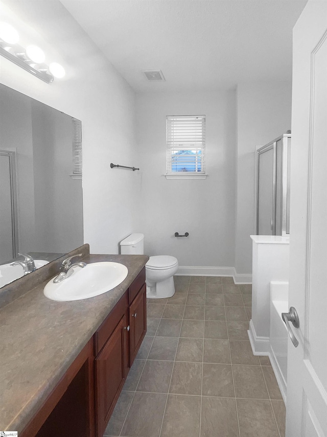 full bathroom featuring toilet, tile patterned flooring, vanity, and shower with separate bathtub