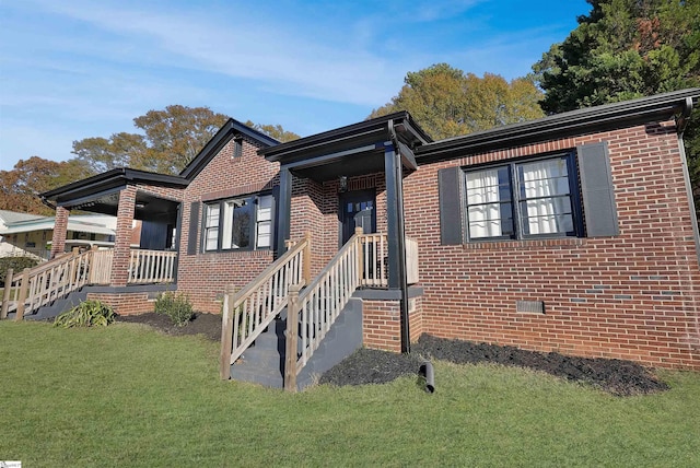 view of front of property with a porch and a front lawn