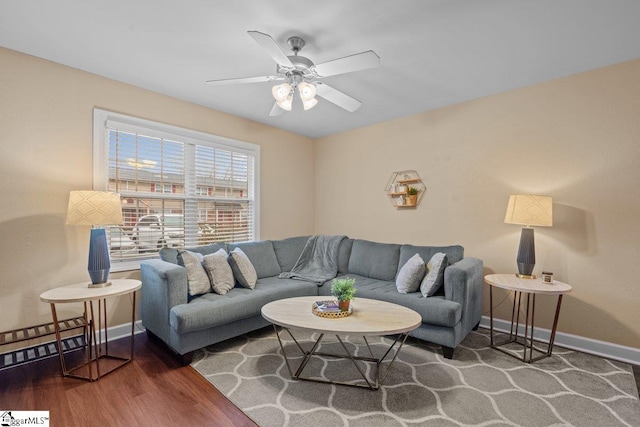 living room featuring hardwood / wood-style flooring and ceiling fan