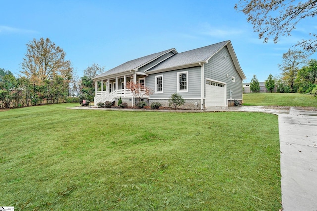 view of front of property featuring a front lawn, a porch, and a garage