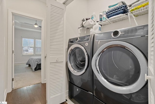 washroom with washer and clothes dryer and dark hardwood / wood-style flooring