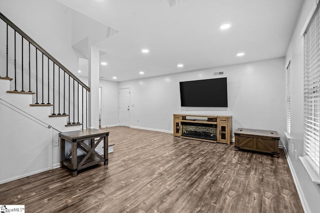 living room featuring hardwood / wood-style flooring and a fireplace