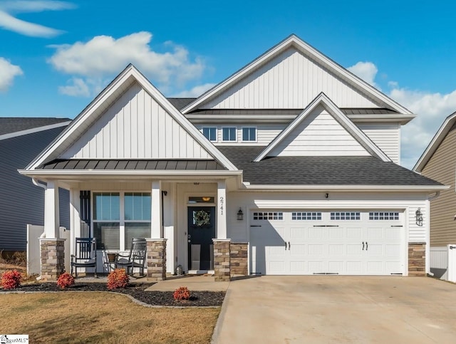 craftsman-style house with a porch and a garage