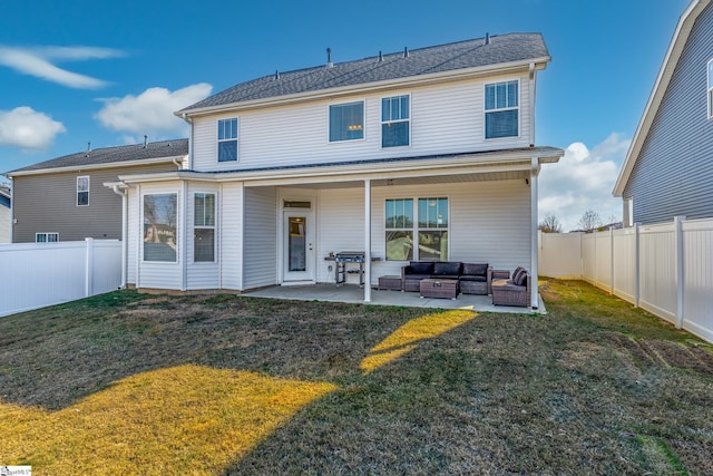 back of house featuring an outdoor living space, a yard, and a patio