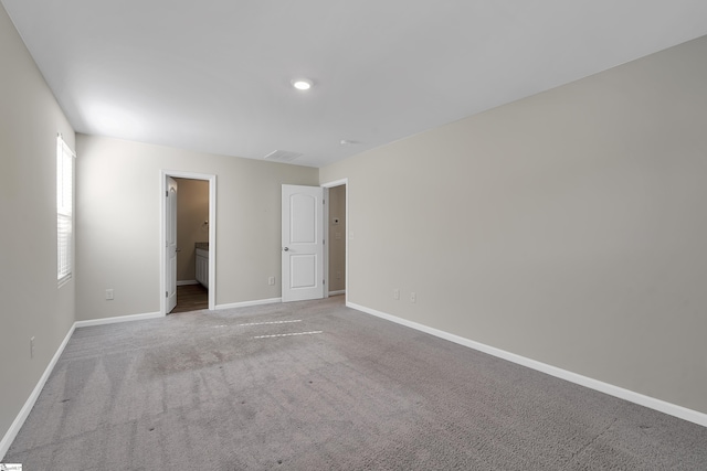 spare room with light colored carpet