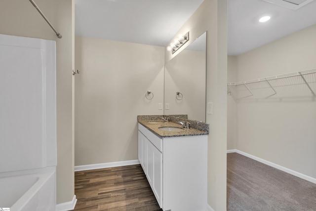 bathroom featuring vanity and hardwood / wood-style flooring