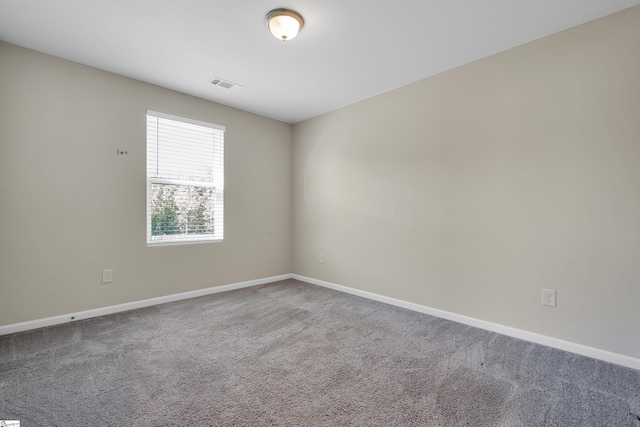 unfurnished room featuring carpet