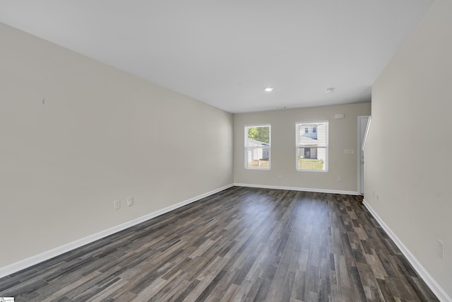 spare room featuring dark hardwood / wood-style floors