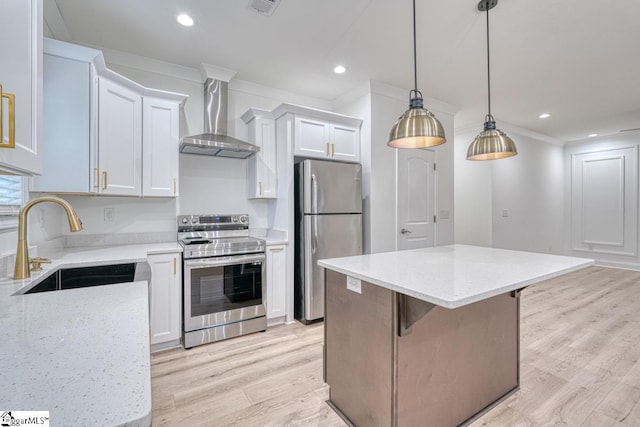 kitchen featuring a center island, sink, stainless steel appliances, wall chimney range hood, and white cabinets