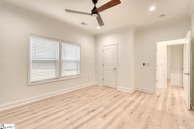 unfurnished bedroom with a closet, light hardwood / wood-style floors, ceiling fan, and ornamental molding