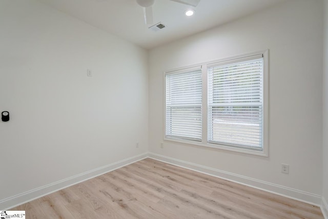 unfurnished room featuring light hardwood / wood-style flooring and ceiling fan