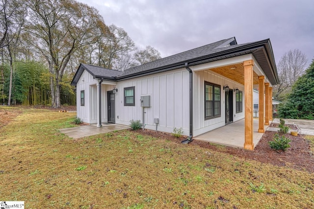 exterior space featuring a patio and a lawn