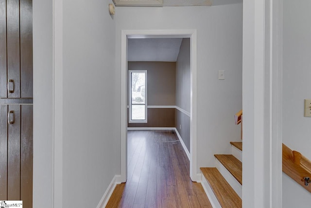 hallway featuring a textured ceiling and hardwood / wood-style flooring