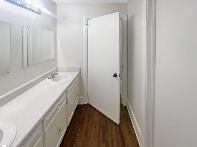 bathroom featuring hardwood / wood-style floors and vanity