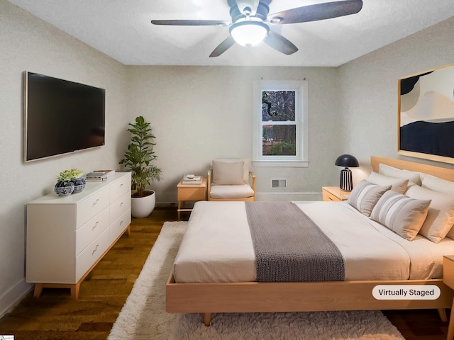 bedroom featuring dark hardwood / wood-style floors and ceiling fan