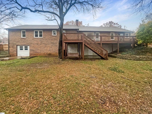 rear view of property with a lawn and a deck