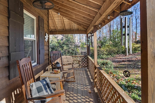 exterior space with ceiling fan and a porch