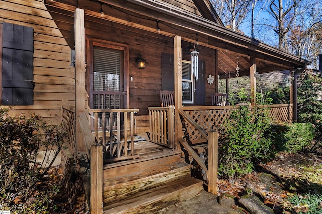 doorway to property featuring a porch