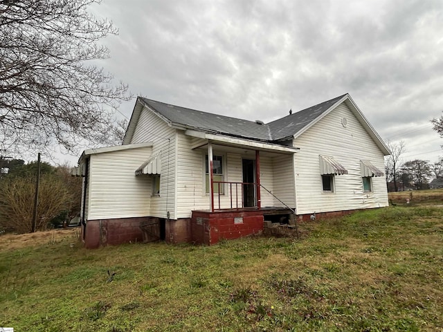 view of home's exterior featuring a lawn