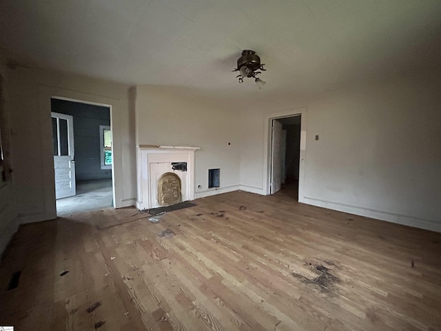 unfurnished living room with light hardwood / wood-style floors