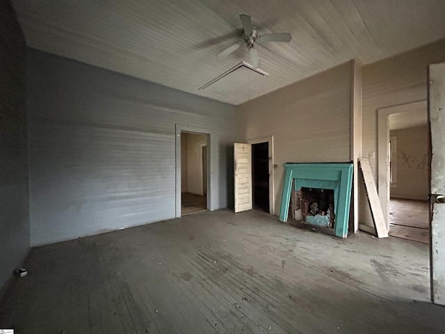 unfurnished living room featuring ceiling fan