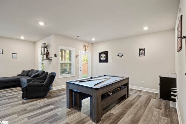 game room with light hardwood / wood-style floors and billiards