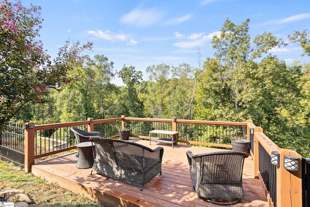 wooden terrace featuring an outdoor hangout area