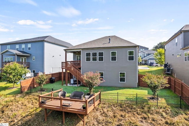 back of house with an outdoor hangout area, a deck, cooling unit, and a lawn