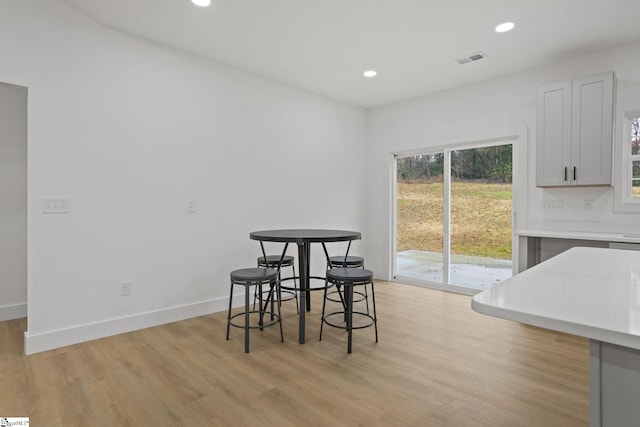 dining area with light hardwood / wood-style flooring