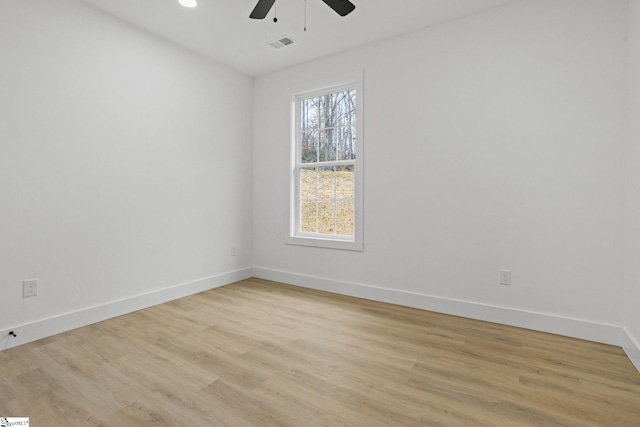 empty room featuring light hardwood / wood-style floors and ceiling fan