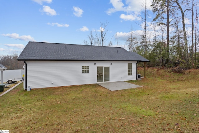 back of property featuring a yard and a patio