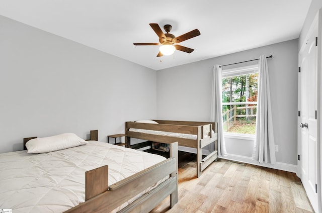 bedroom featuring ceiling fan and light wood-type flooring