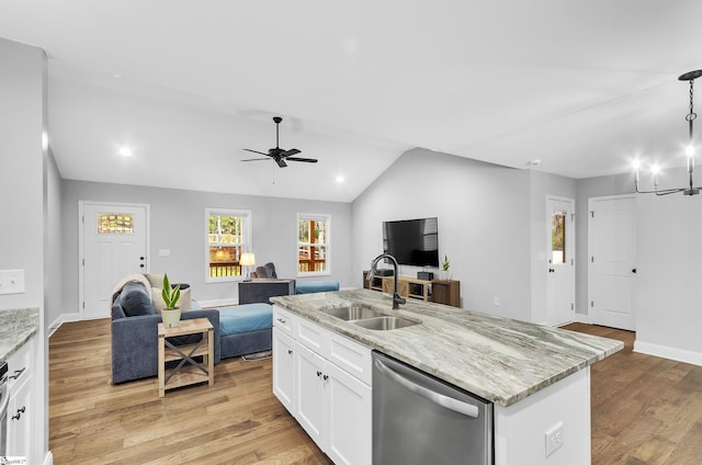 kitchen featuring white cabinets, a center island with sink, light hardwood / wood-style flooring, dishwasher, and lofted ceiling