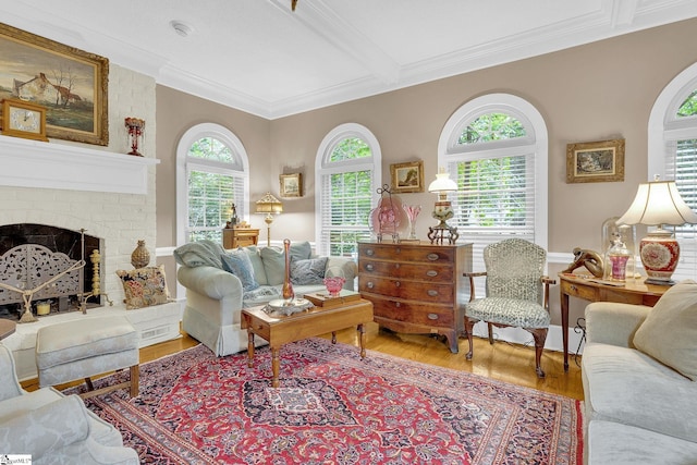 living room with hardwood / wood-style floors, plenty of natural light, and ornamental molding