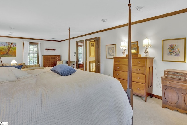 bedroom featuring crown molding and light carpet