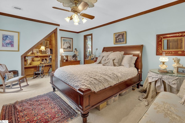 bedroom featuring ceiling fan, crown molding, and light colored carpet