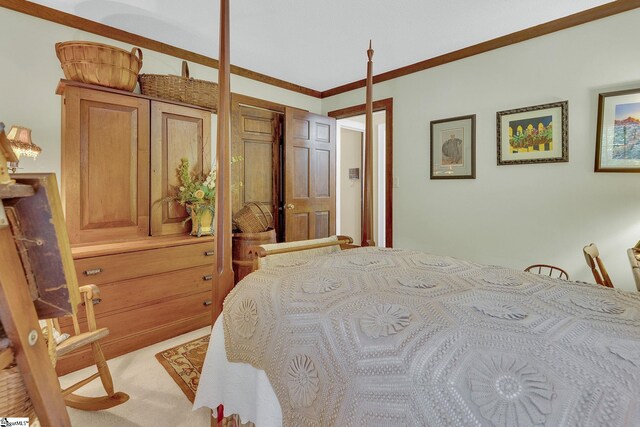 bedroom featuring ornamental molding, light carpet, and a closet