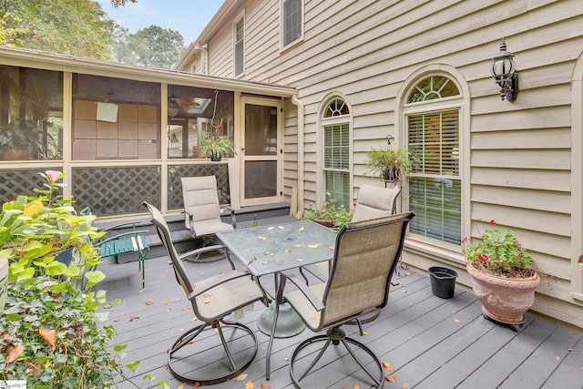 deck with a sunroom