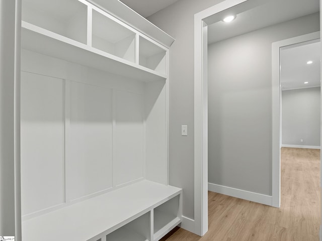 mudroom with light hardwood / wood-style flooring