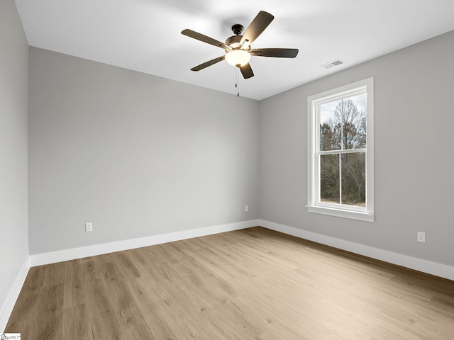 unfurnished room with ceiling fan and light hardwood / wood-style floors