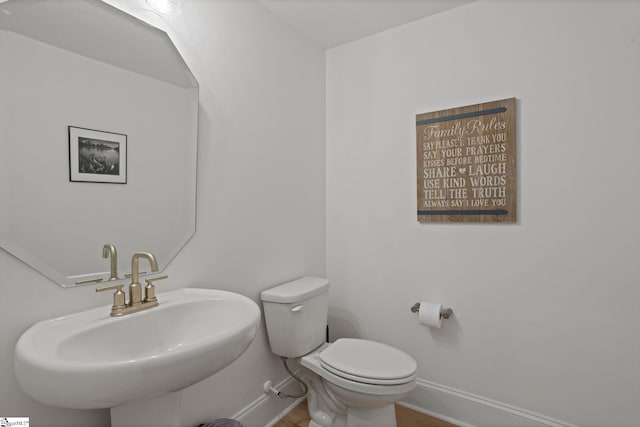 bathroom with toilet and sink