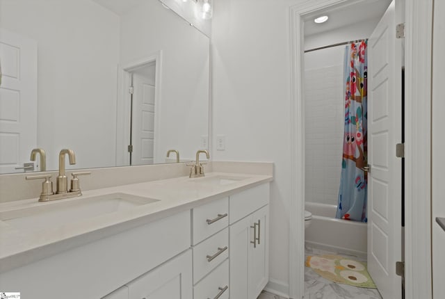 bathroom featuring vanity and shower / tub combo