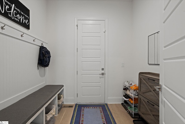 mudroom with wood-type flooring